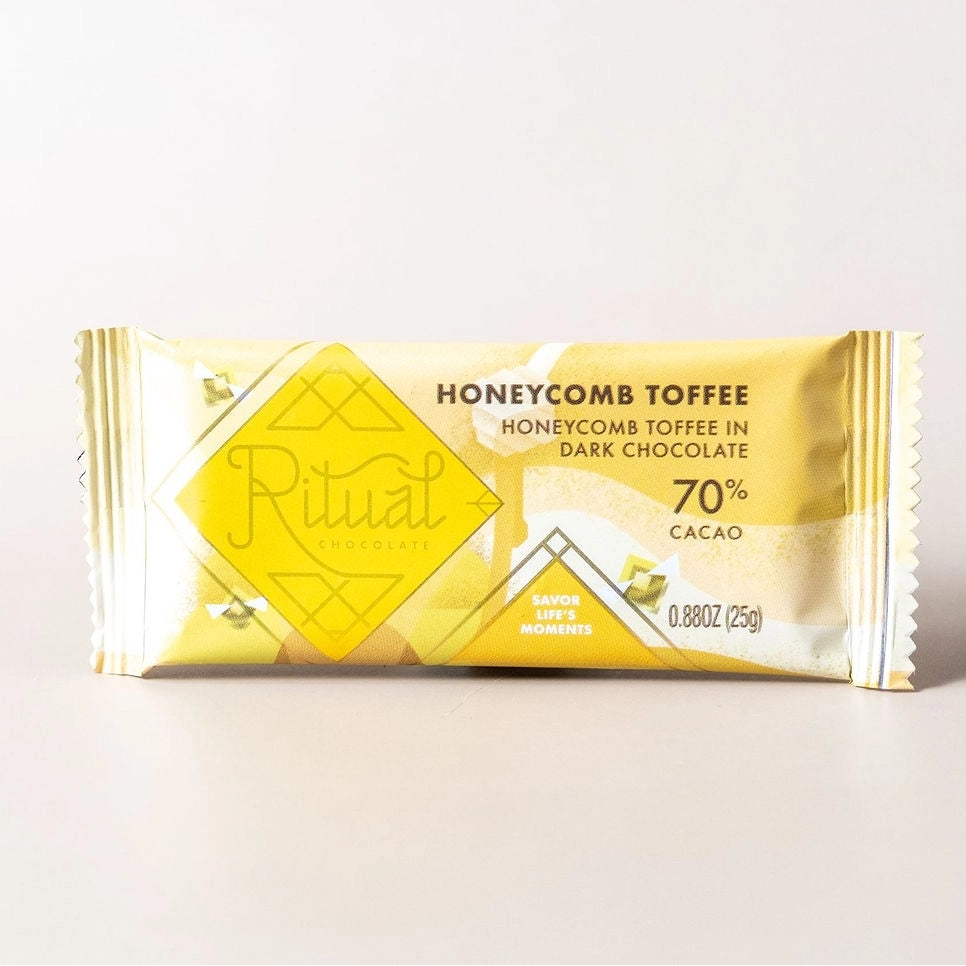Chocolate bar with honeycomb toffee on a white background