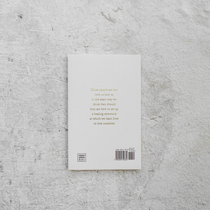 Book cover with text on a textured gray surface