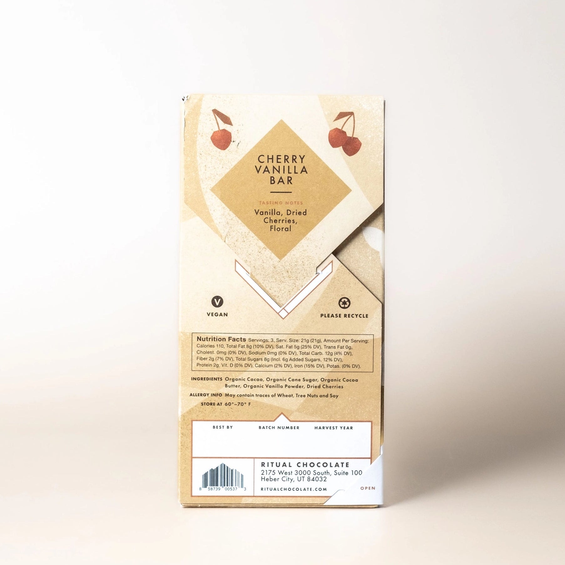 Chocolate bar packaging with cherry design on a light background