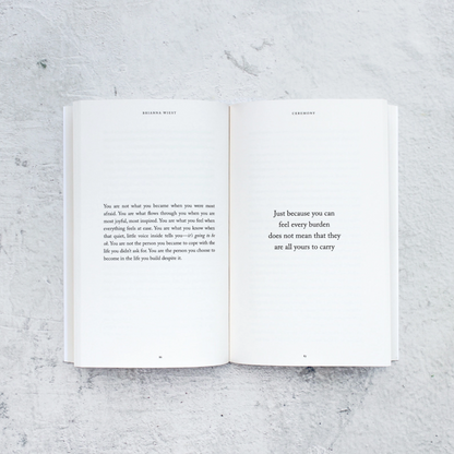 Open book with text on a textured gray surface