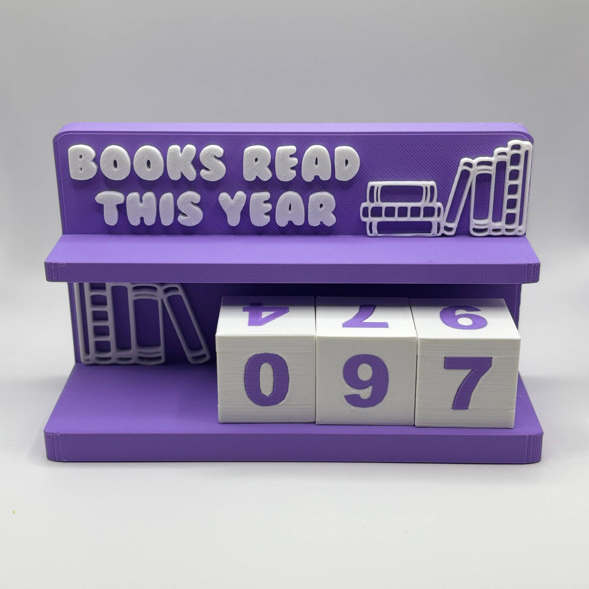 Purple bookshelf with 'Books Read This Year' display and number blocks on a white background