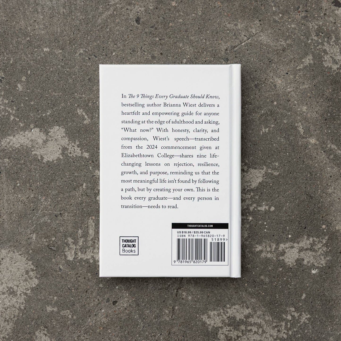 Book back cover on a textured stone surface