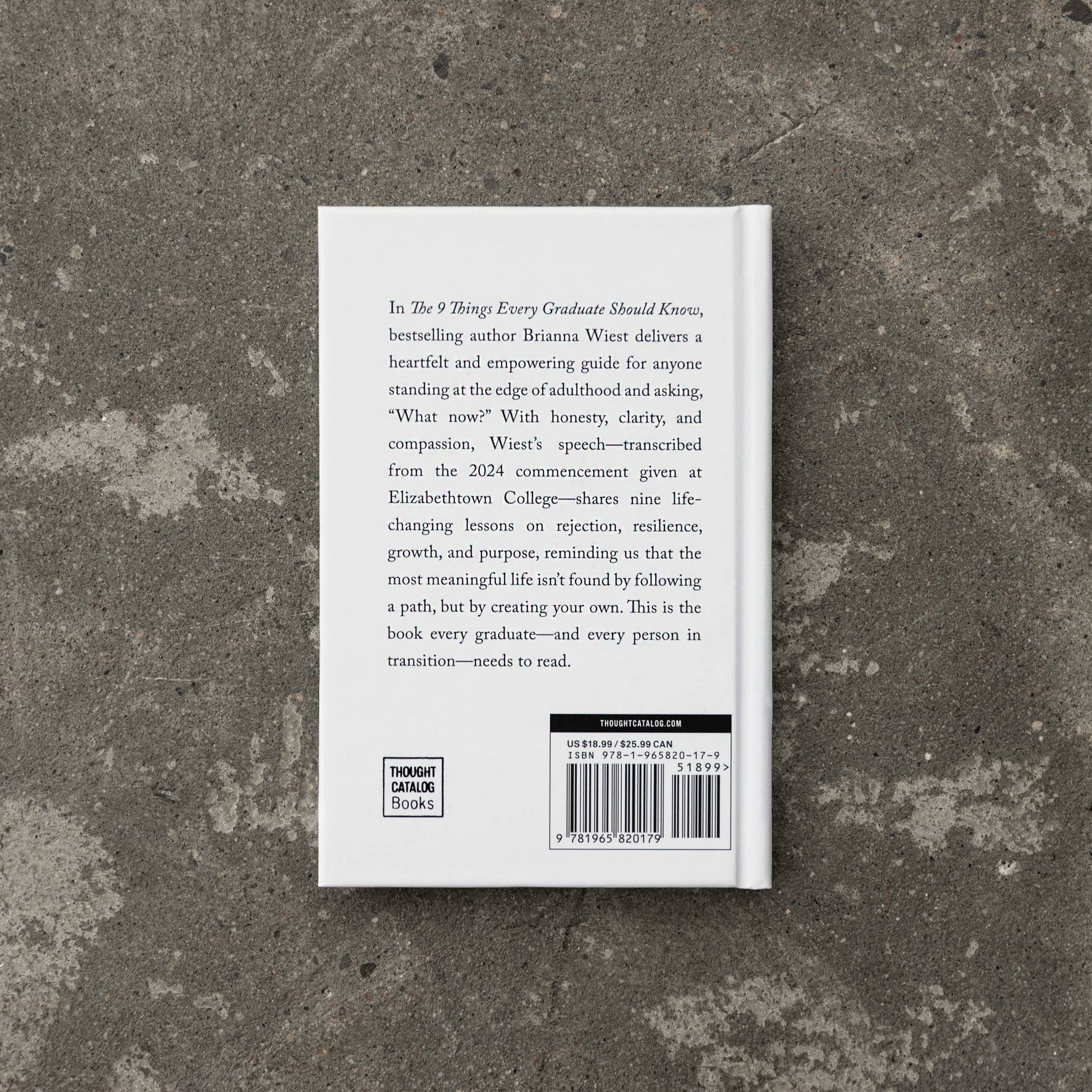 Book back cover on a textured stone surface
