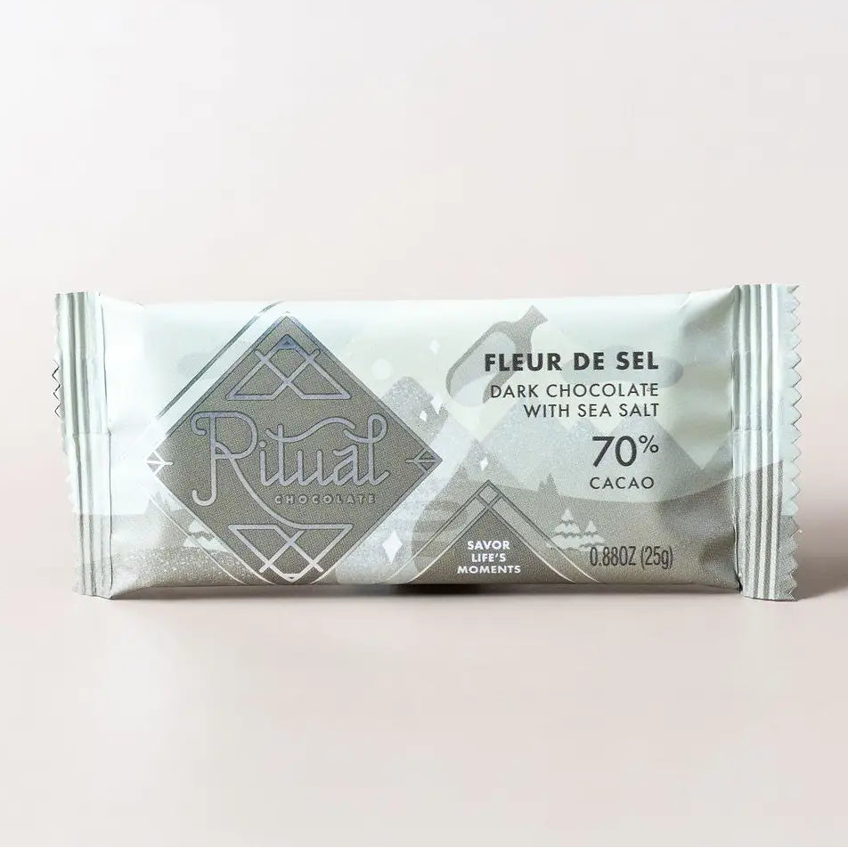 Ritual Fleur de Sel dark chocolate bar packaging on a light pink background
