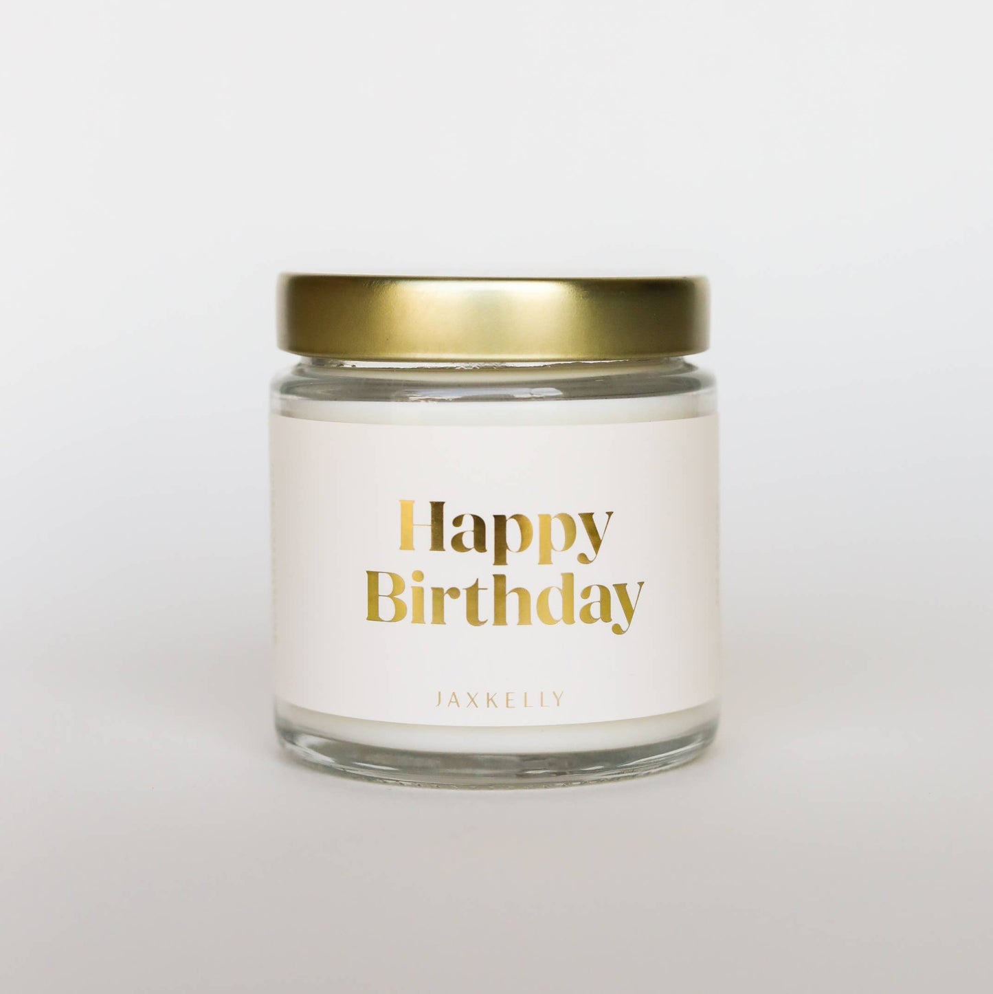 Candle jar with 'Happy Birthday' text on a white background