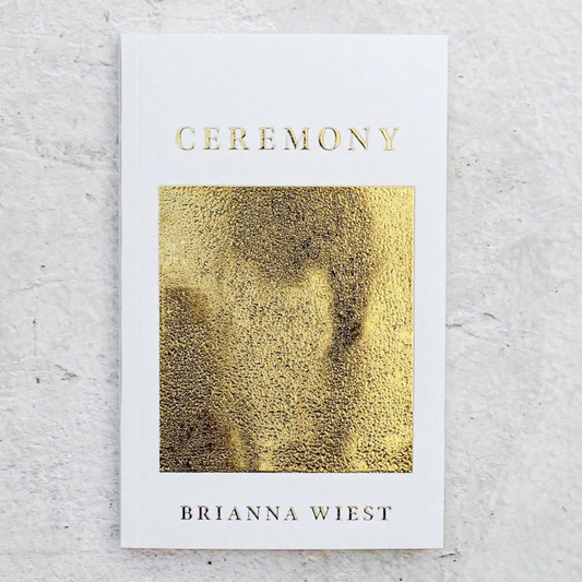 Book titled 'Ceremony' by Brianna Wiest with gold cover on a light gray background