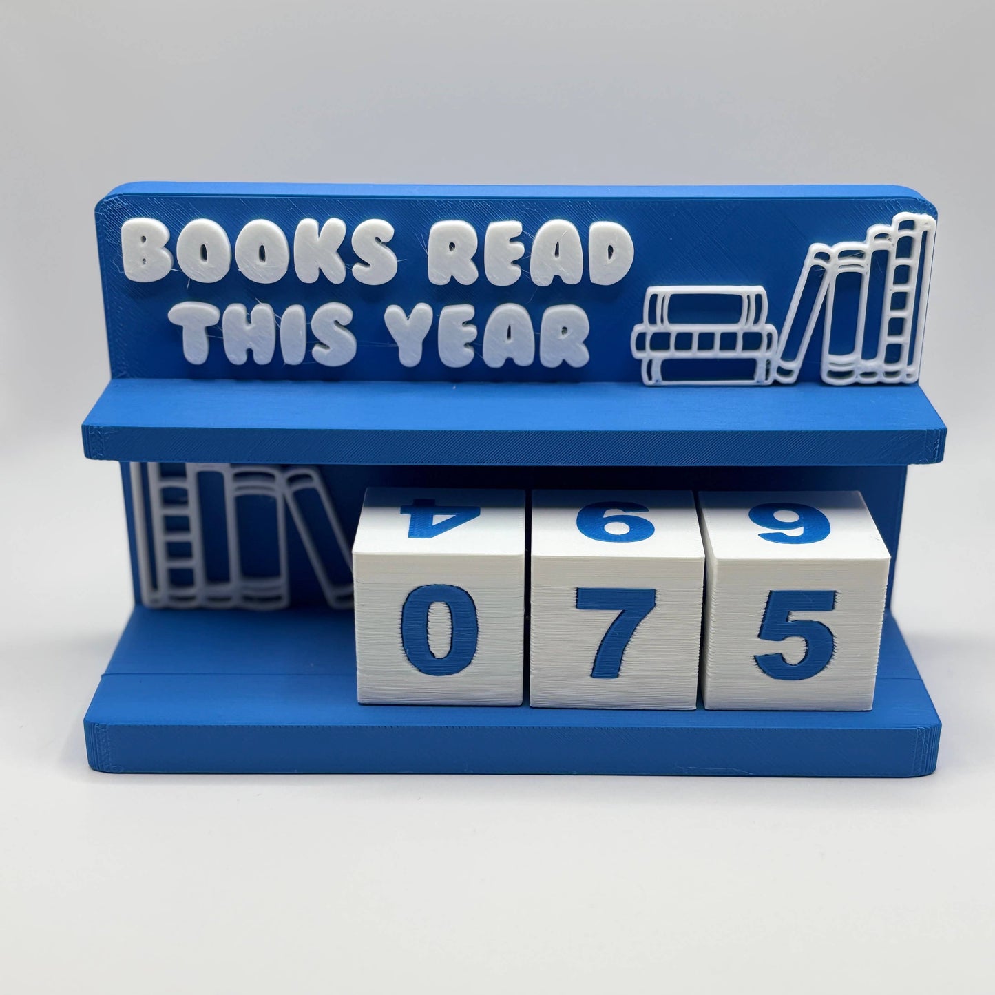 Blue holder with 'Books Read This Year' text and number blocks displaying '075'.