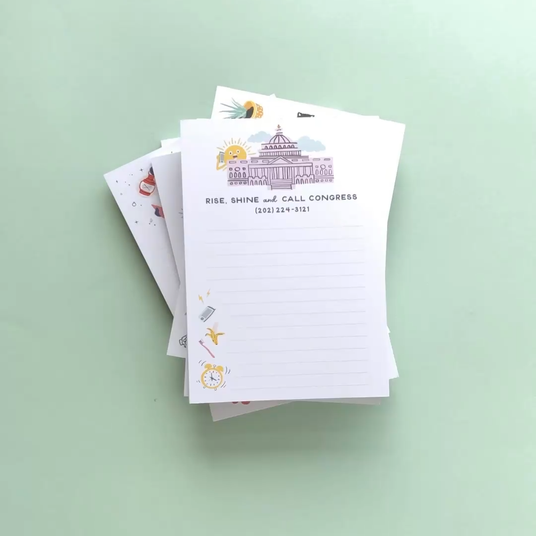 Stack of notepads with illustrated notepads on a light green background